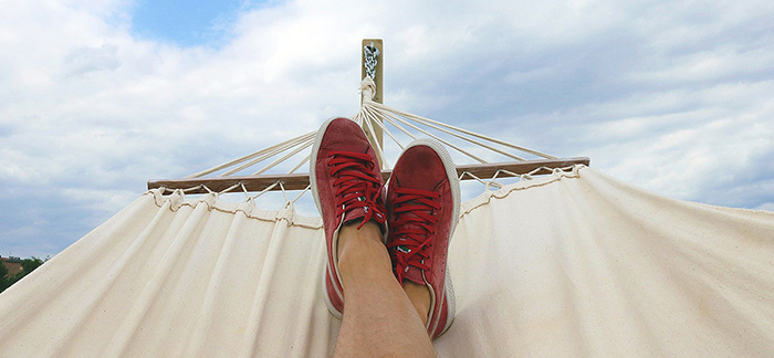 mental health break feet in a hammock